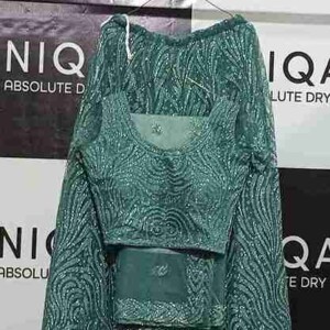 Spotless. Fragrant. Ready to Wear. Discover the finishing touch of Uniqare Dry Clean in Gurgaon. Freshly dry cleaned garment hanging neatly at Uniqare Dry Clean shop in Gurgaon