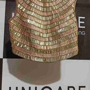 Handled with precision and care – every garment gets the Uniqare Dry Clean touch. A professional dry cleaner organizing freshly dry-cleaned clothes on hangers